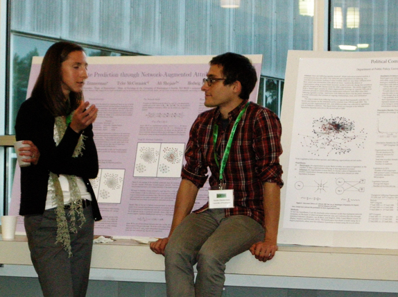 Bailey talking to someone at a poster session